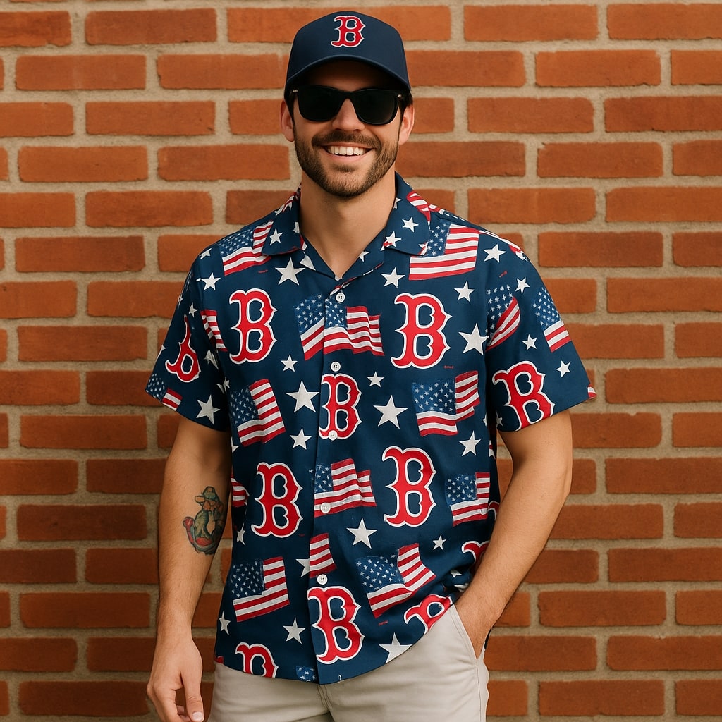 Man wearing Boston Red Sox Hawaiian shirt and cap with USA flag patterns, smiling in front of red brick wall.